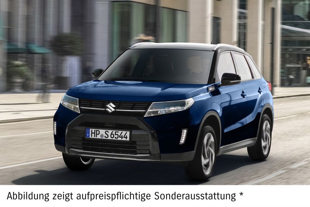 Dunkelblauer Suzuki Vitara fährt auf einer Straße.